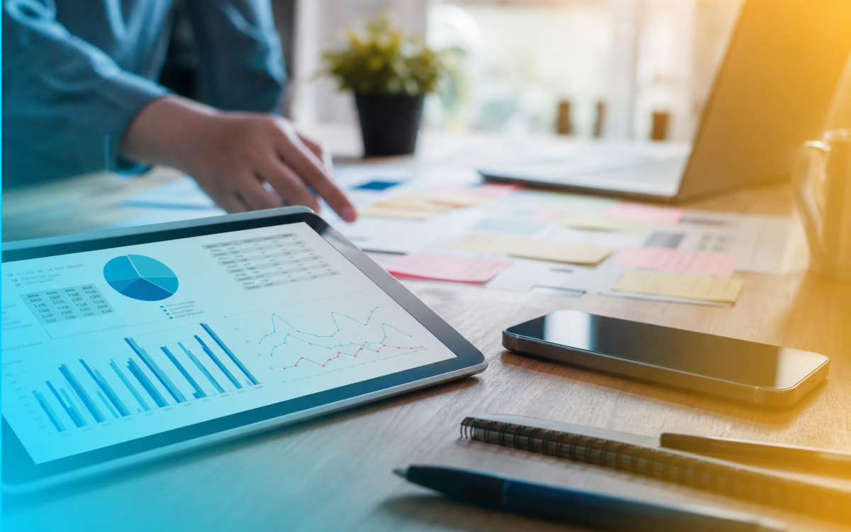 Digital marketing agency workspace with analytics tablet and campaign tools